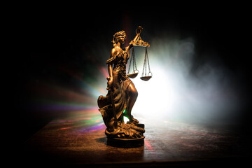 The Statue of Justice - lady justice or Iustitia / Justitia the Roman goddess of Justice on a dark...