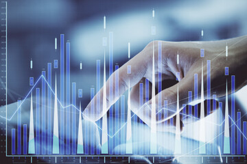 Multi exposure of man's hands holding and using a digital phone and forex graph drawing. Financial market concept.