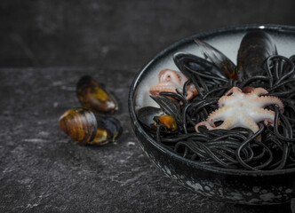 Black spaghetti pasta with octopus and mussels