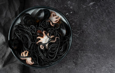 Black spaghetti pasta with octopus and mussels