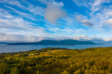 Sunrise View of Orcas Island as Seen from Lummi Island, Washington. Aerial drone view of an island in the San Juan Island archipelago of the Salish Sea area of western Washington state.