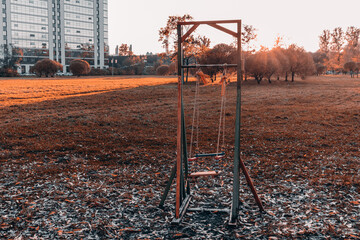 Children's swings are an autumn fairytale fantastic world.  infrared art processing  foliage lonely