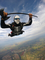 Parachutist dressed for the Helloween in free fall.