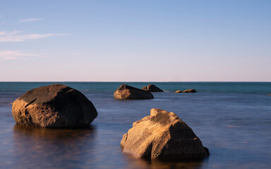 Tranquil Seascape with ancient sea stones in the ocean