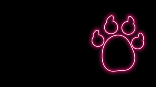 Glowing neon line Paw print icon isolated on black background. Dog or cat paw print. Animal track. 4K Video motion graphic animation