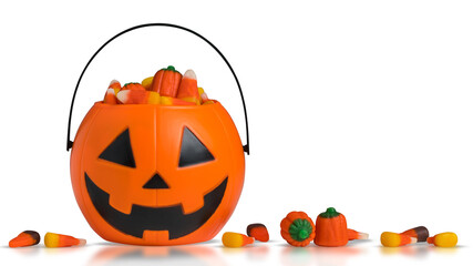 Halloween pumpkin Jack-o-lantern bucket with candy corn for celebration halloween. Orange pumpkin with scary smile face Jack-o-lantern. Bucket for candy. Trick or treat and Happy Halloween