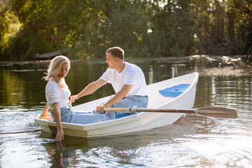 Couple man and woman ride on boat