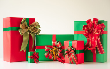A lot of gift box mockup wrapped decorated with ribbon bow. Big pile of gift set stack on white...