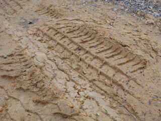 tires stamp on ground texture.