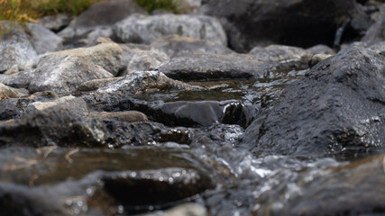 water flowing on rocks