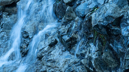 water flowing into the rocks
