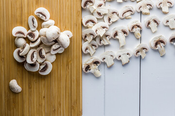 Fresh mushrooms champignon on a wooden board.