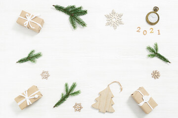Christmas gift, wooden toys, fir tree branches, winter holiday and New Year background with copy space, handmade present for friends or family.