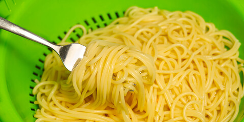 boiling pasta spaghetti in pot. penne rigate pasta- Cooking italian pasta