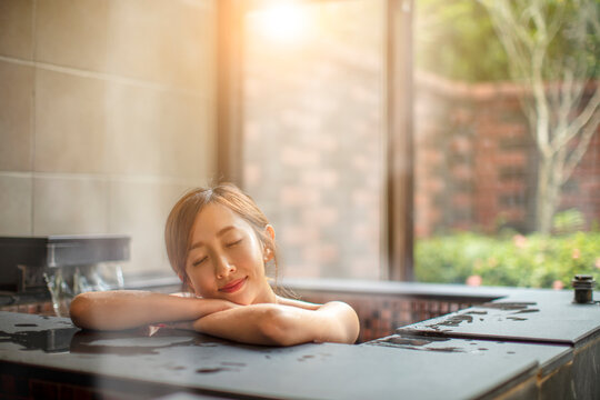 Beautiful Young Woman Relaxing  In Hot Spring