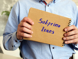 Financial concept about Subprime Loans with sign on the page.