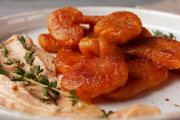 Pumpkin gnocchi with Morne sauce on a plate. Horizontal view