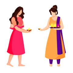 Two Young Girls Holding Lit Oil Lamps (Diya) in Modern and Traditional Dress.