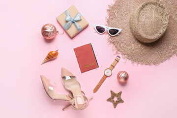 Composition with Christmas decor, passport and female accessories on color background