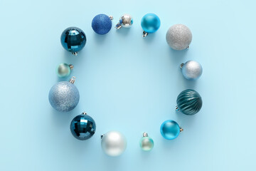 Beautiful Christmas baubles on color background