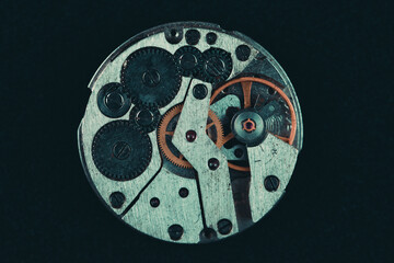 Old clockwork mechanism in close-up. Selective focus on macro details. Light vintage toning. Grunge...