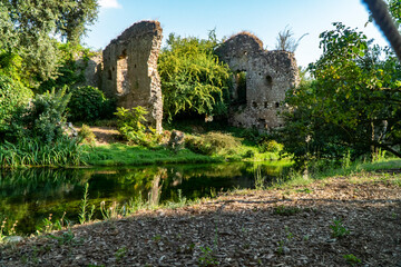 Fototapeta na wymiar Garden of Ninfa and ruins of the medieval city Ninfa in Italy in the province of Latina