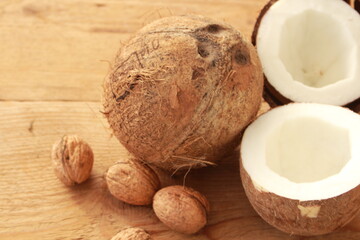 a sliced coconut with coconut milk in a glass