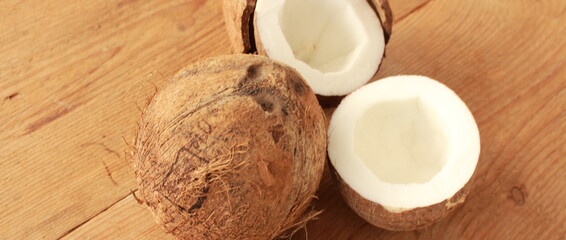 a sliced coconut with coconut milk in a glass