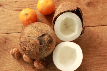 a sliced coconut with coconut milk in a glass