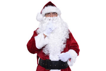 Senior man wearing a traditional Sant Claus costume with a finger raised to his lips making Shh gesture.