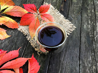 up of coffee with autumn leaves