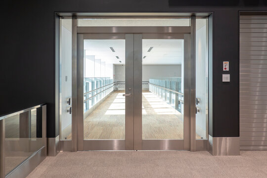 Transparent door on corridor of modern building
