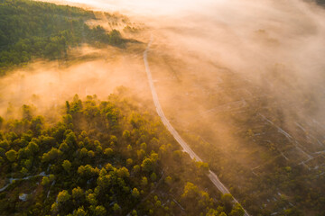 Misty sunrise in the mountains with a beautiful sky. Aerial view