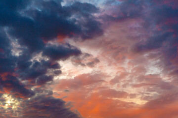 Clouds in the sky. Clouds at sunset. Sunset. The sky at sunset. Multi-colored clouds at sunset. Dark sky with clouds. Thick vapor texture. Natural abstraction. High in the sky. Dramatic background