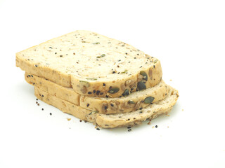 Fresh homemade slice of whole wheat bread isolated on a white background..