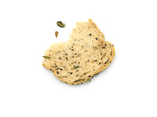 Fresh homemade slice of whole wheat bread broken into two halves with falling seed down, isolated on white background. Top view...