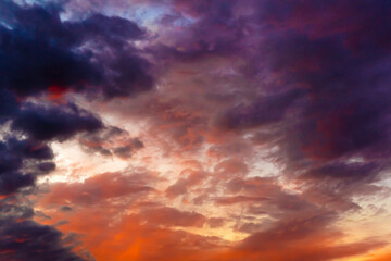 Obraz premium Clouds in the sky. Clouds at sunset. Sunset. The sky at sunset. Multi-colored clouds at sunset. Dark sky with clouds. Thick vapor texture. Natural abstraction. High in the sky. Dramatic background