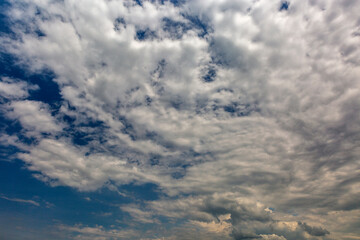 Cloudscape with white clouds against blue sky