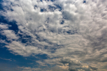 Cloudscape with white clouds against blue sky