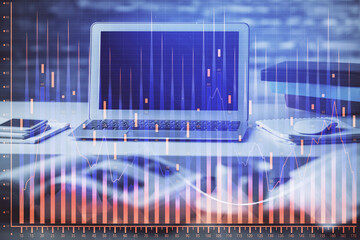 Financial graph colorful drawing and table with computer on background. Double exposure. Concept of international markets.