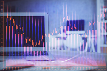 Stock market graph and table with computer background. Multi exposure. Concept of financial analysis.