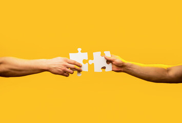 Man hands connecting couple puzzle piece. Business solutions, target, success, goals and strategy...