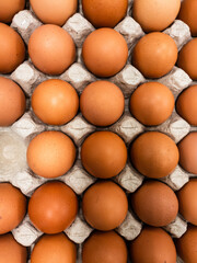 Chicken eggs are arranged for background design. Piles of groceries to create designs about agriculture, food, nature, & healthy living.