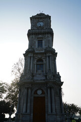 Exterior Neoclassical architecture and clock tower design of 'Dolmabahce imperial palace' located along the European shore of the Bosphorus Strait- Istanbul, Turkey