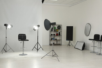 Interior of modern photo studio with professional equipment