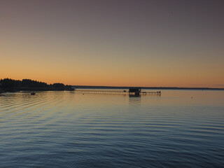 Fototapeta na wymiar Sunset, summer, beautiful sky. Pier on the big Kama river. Ural, Russia, Perm Territory, Elovo.