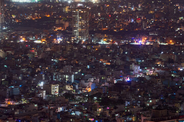 Obraz na płótnie Canvas Nightscape of Ho Chi Minh City near residential area.