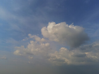 Beautiful white fluffy cloudy sky background,