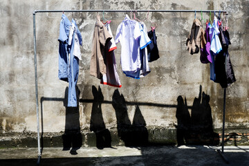 Dry clothes outdoor in summer with heavy sunlight