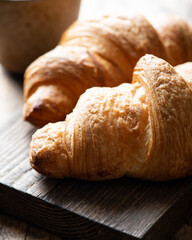 croissant on a wooden board, selective focus, close-up